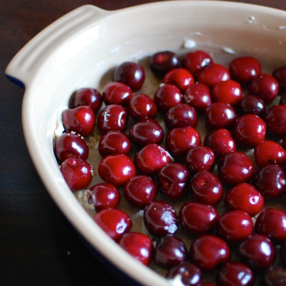 Cherries layered in a baking dish